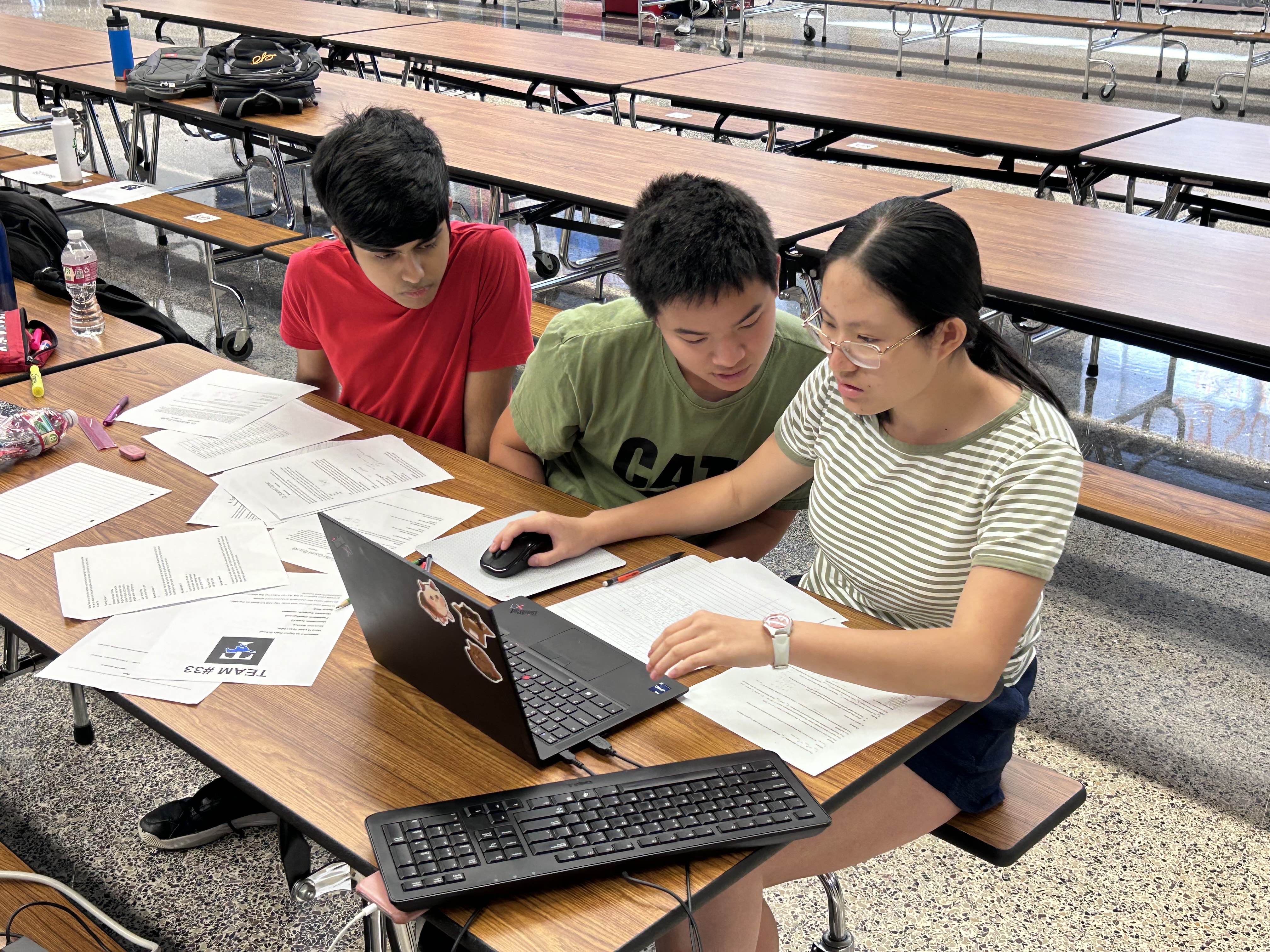 Students coding together